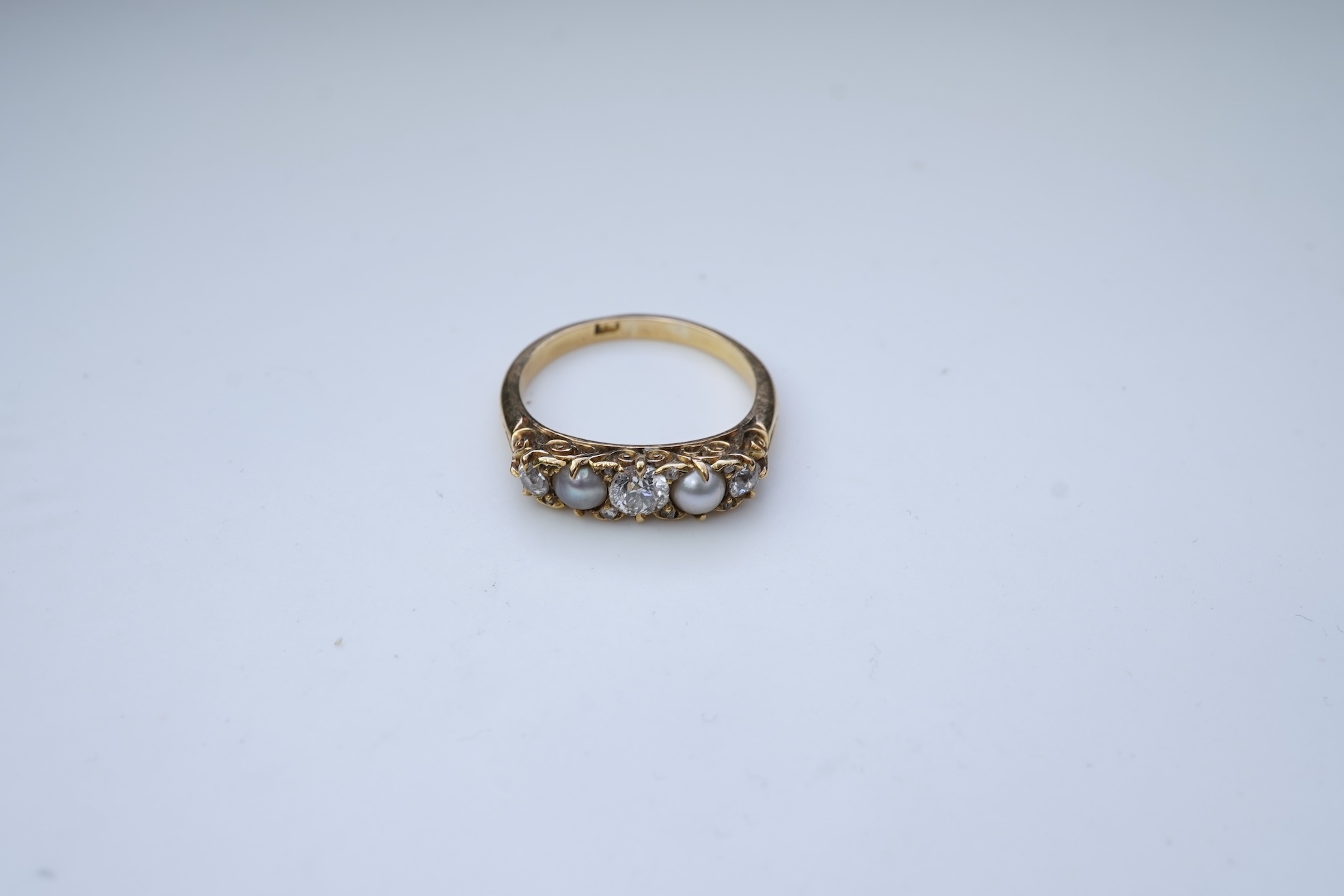 A five-stone pearl and diamond ring, early 20th century